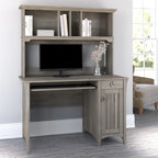 Petit bureau d'ordinateur avec étagère de rangement sur le dessus